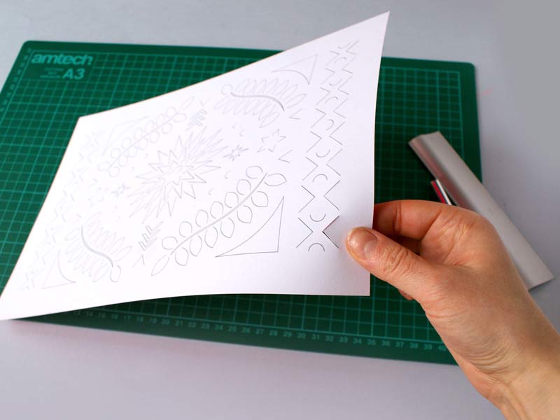 Creating a composition using paper cutting