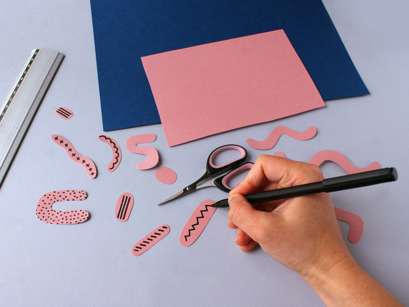 Creating a composition using paper cutting
